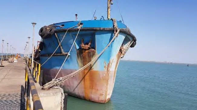 A bulk cargo vessel berthed at an export terminal